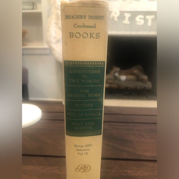 Anthropologie: Hand cut letters from Reader’s Digest books. Spells out “HOME.” - Picture 5 of 15